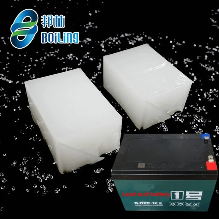 Two white hot melt adhesive blocks beside a lead-acid battery on a black background with the Boiling logo